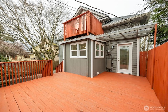 wooden terrace featuring fence