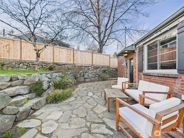 view of patio / terrace featuring a fenced backyard and an outdoor hangout area