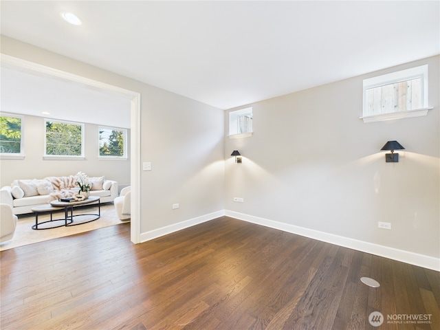 interior space featuring dark wood-style floors, recessed lighting, and baseboards