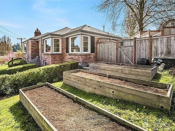 exterior space featuring a vegetable garden and fence