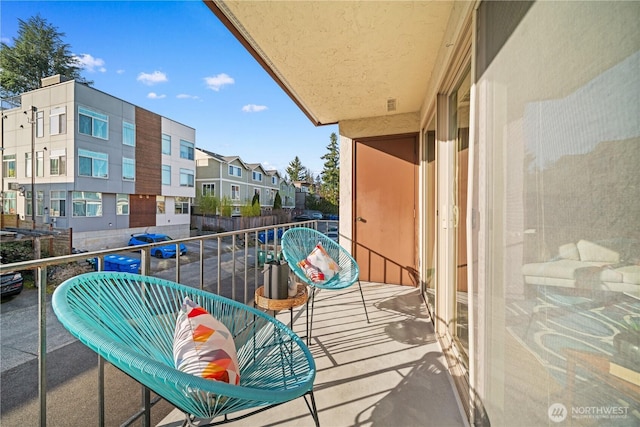 balcony featuring a residential view