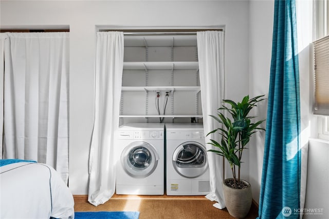 washroom with laundry area and washing machine and dryer