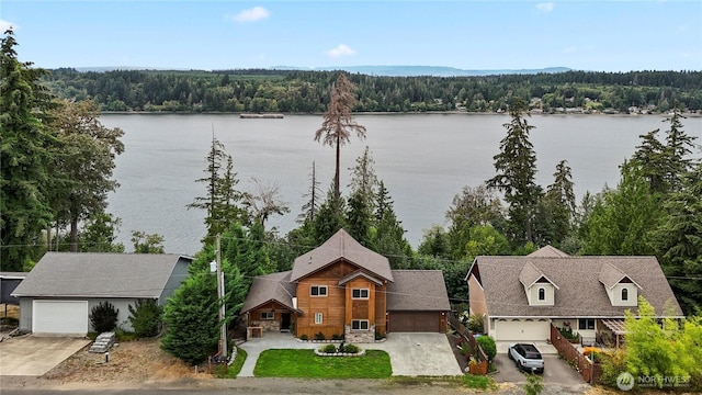 property view of water featuring a wooded view