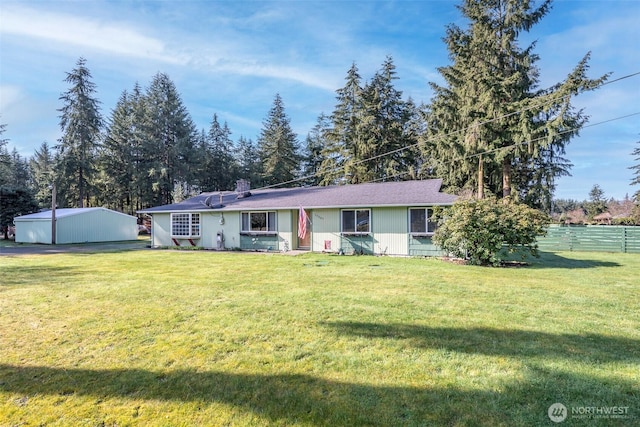 ranch-style home with fence, a chimney, and a front lawn