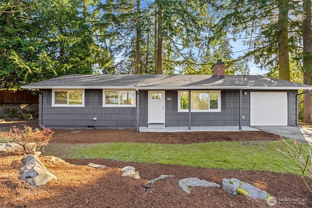 single story home with roof with shingles, a chimney, crawl space, a garage, and driveway