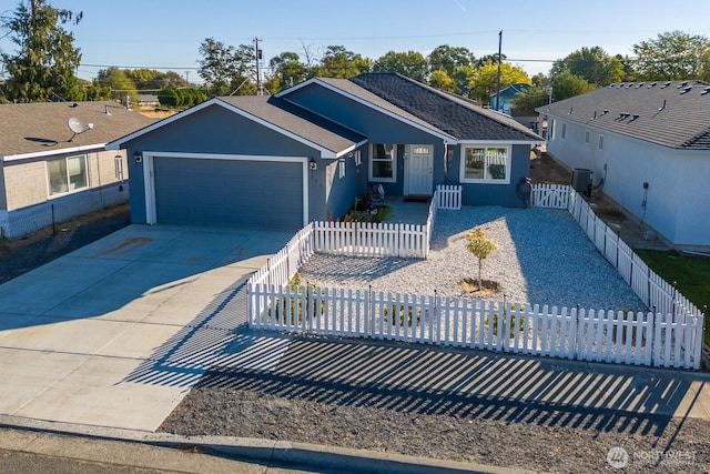 ranch-style house featuring a fenced front yard, an attached garage, cooling unit, driveway, and stucco siding