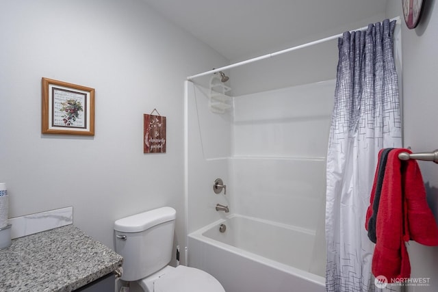 full bath with toilet, shower / bath combo with shower curtain, and vanity