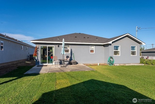 back of house featuring a patio area, a yard, central AC unit, and stucco siding