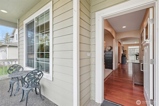 view of exterior entry with a porch