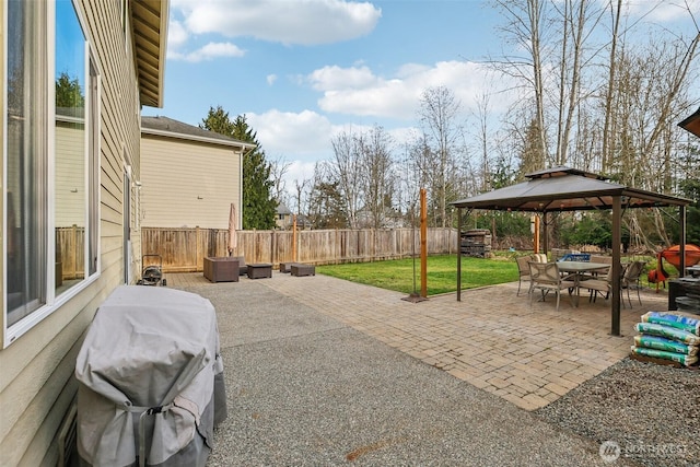 view of patio / terrace with a gazebo, outdoor dining area, a fenced backyard, and a grill