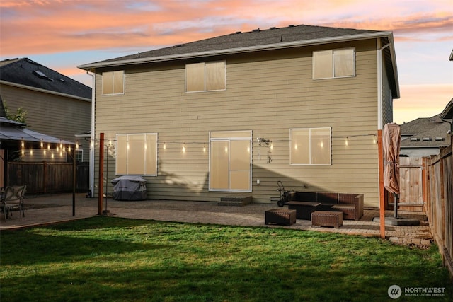 back of house featuring a patio area, a lawn, outdoor lounge area, and a fenced backyard