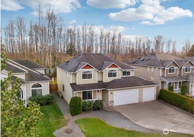 traditional-style house with concrete driveway and a garage