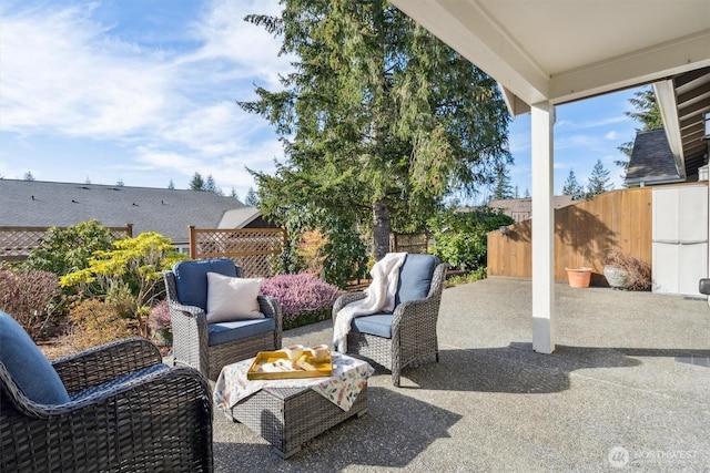 view of patio / terrace featuring fence