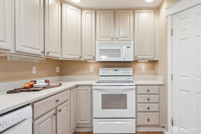 kitchen featuring white appliances and light countertops