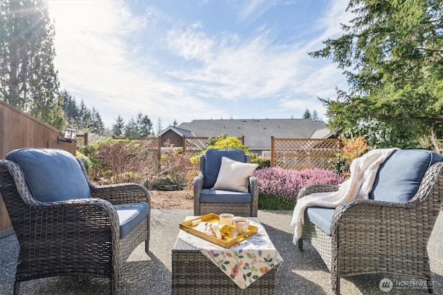 view of patio with outdoor lounge area and fence