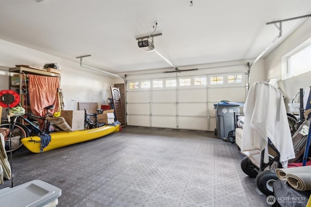 garage featuring a garage door opener