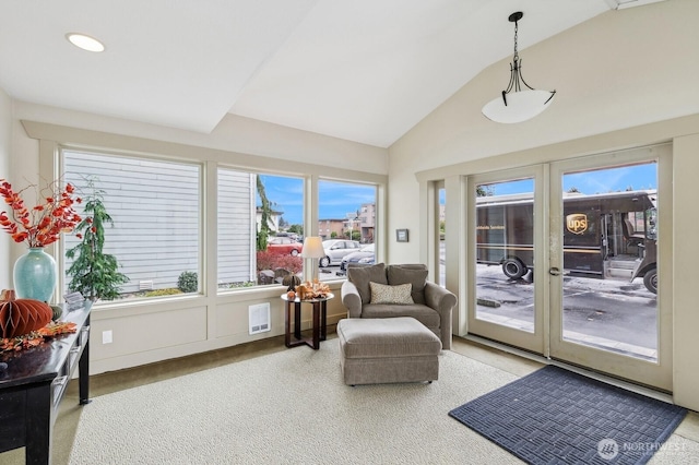 sunroom / solarium featuring vaulted ceiling