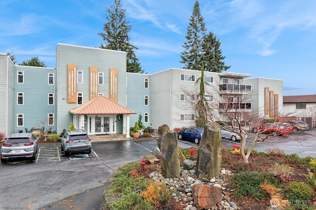 view of property featuring uncovered parking