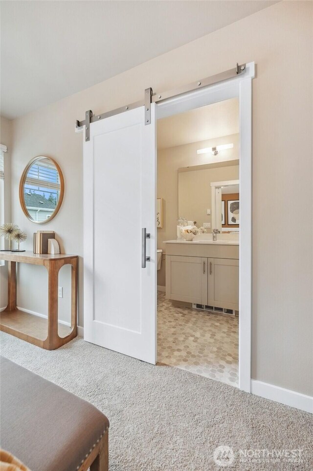 bathroom featuring vanity and baseboards