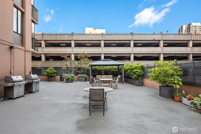 view of patio featuring a grill, a gazebo, and an outdoor hangout area