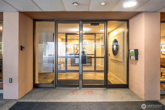 property entrance featuring stucco siding