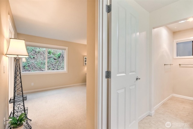 hallway featuring baseboards