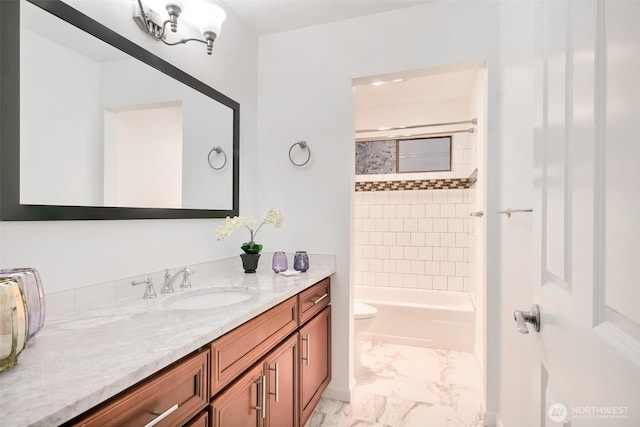 full bath with toilet, marble finish floor, tub / shower combination, and vanity