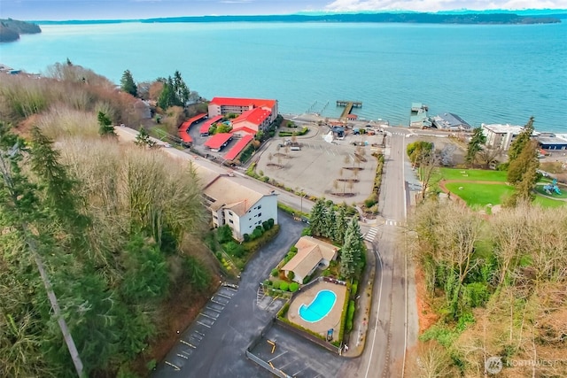 birds eye view of property with a water view