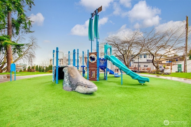 community play area with a lawn