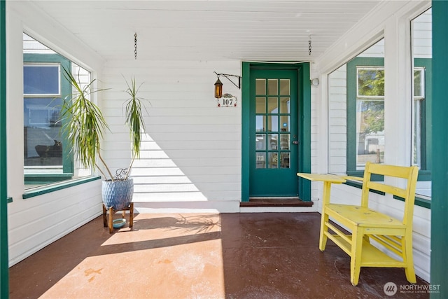 doorway to property featuring a porch