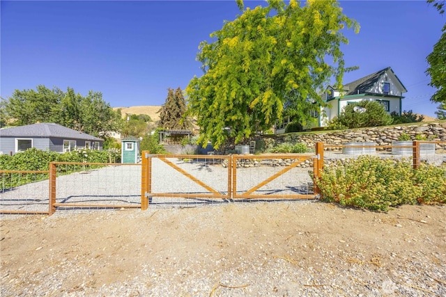 view of gate featuring fence