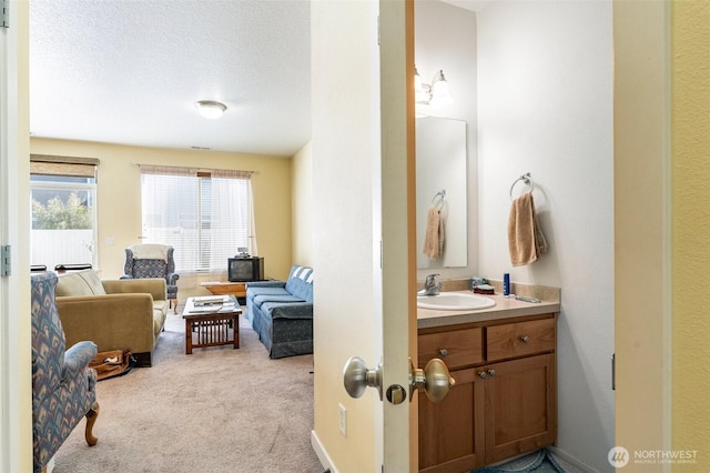 bathroom with vanity and a textured ceiling