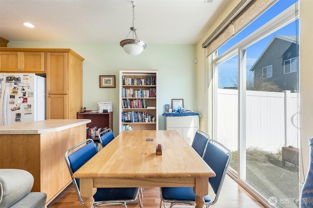 dining room featuring recessed lighting and wood finished floors