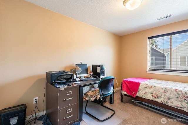 bedroom with carpet floors, visible vents, a textured ceiling, and baseboards