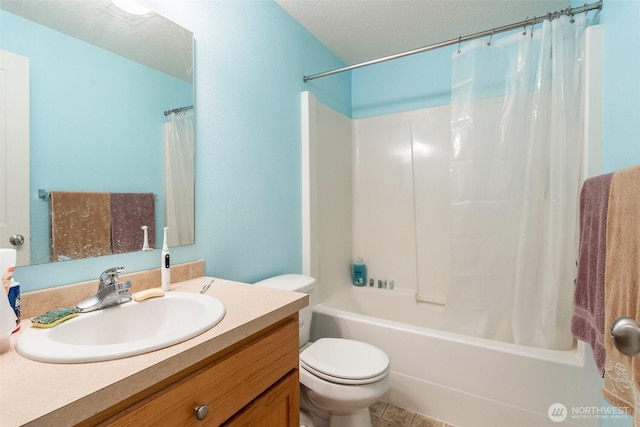 bathroom featuring toilet, shower / tub combo, and vanity