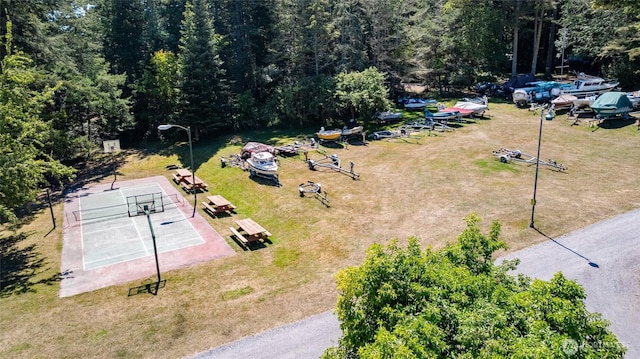 birds eye view of property with a forest view
