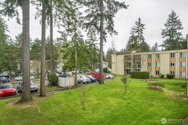 view of home's community featuring a lawn