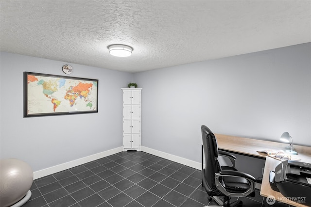 office space featuring a textured ceiling and baseboards