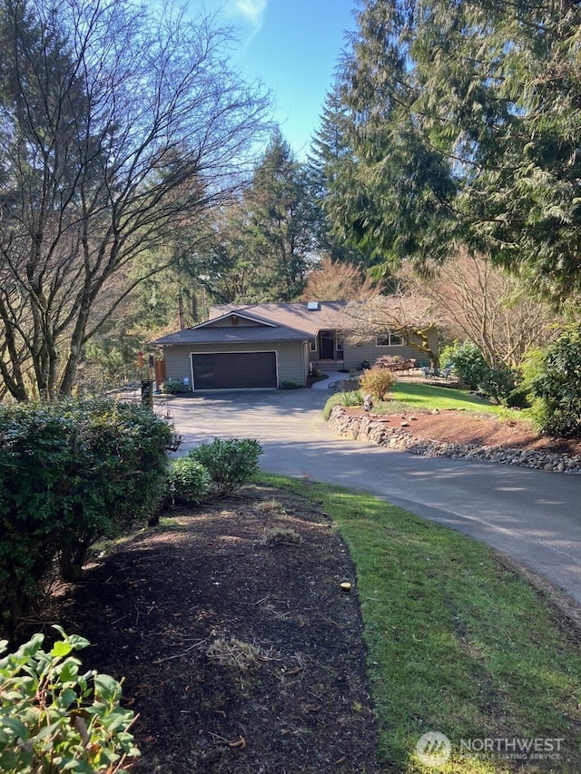 exterior space featuring a garage and concrete driveway