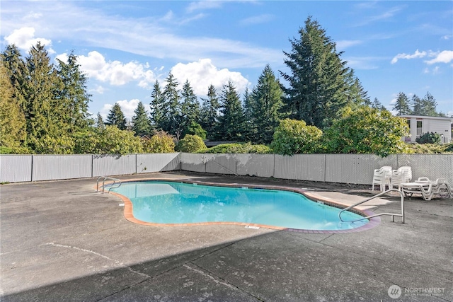 view of pool featuring a fenced in pool, fence, and a patio