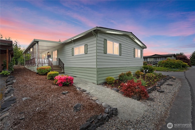 12308 123rd Street Ct E Unit 40, Puyallup, WA 98374 - view of side of home featuring covered porch
