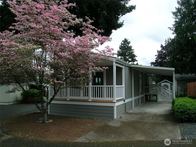 921 Autumn Ln Unit 227, Bellingham, WA 98229 - view of front of property with covered porch, an attached carport, and driveway