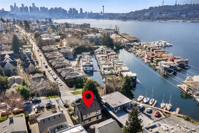 aerial view with a water view and a city view