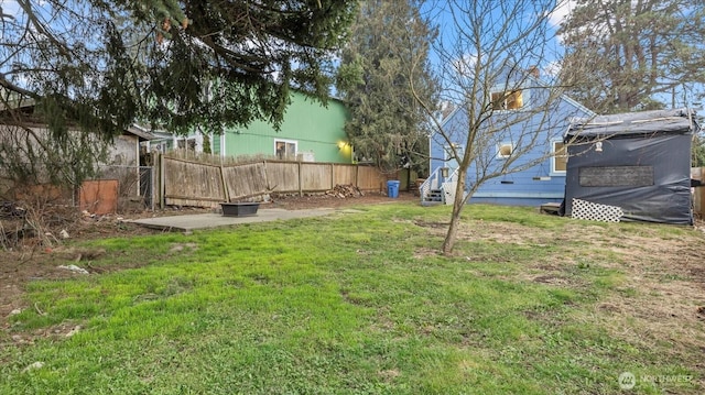 view of yard featuring entry steps and fence