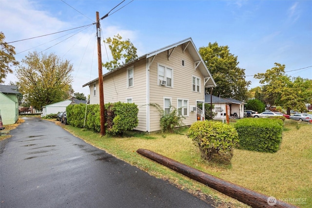 view of home's exterior featuring a lawn