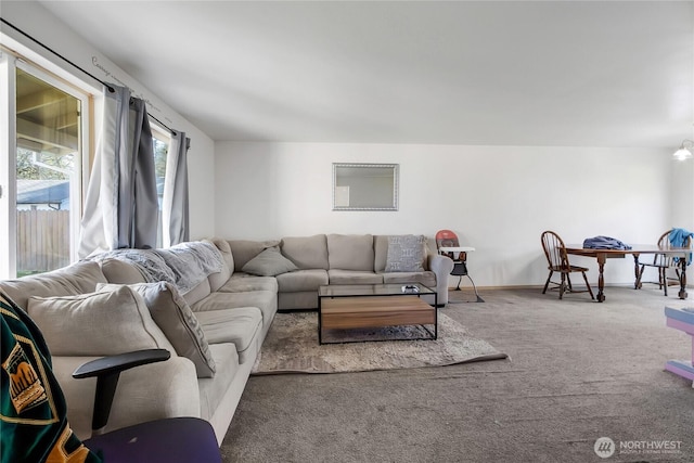 carpeted living room with baseboards