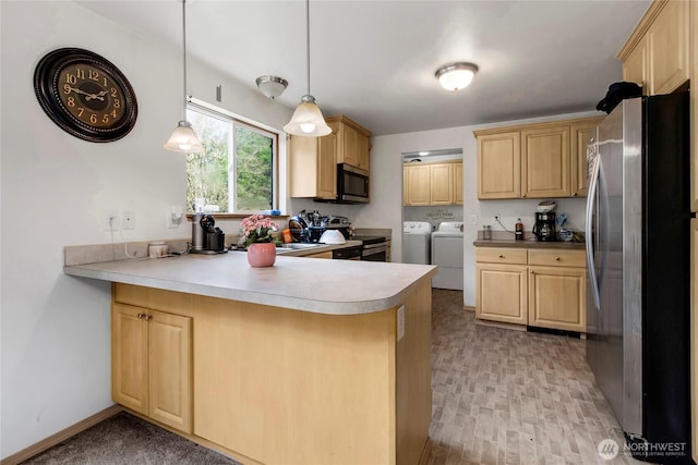 kitchen with stainless steel appliances, washer and dryer, and light brown cabinetry