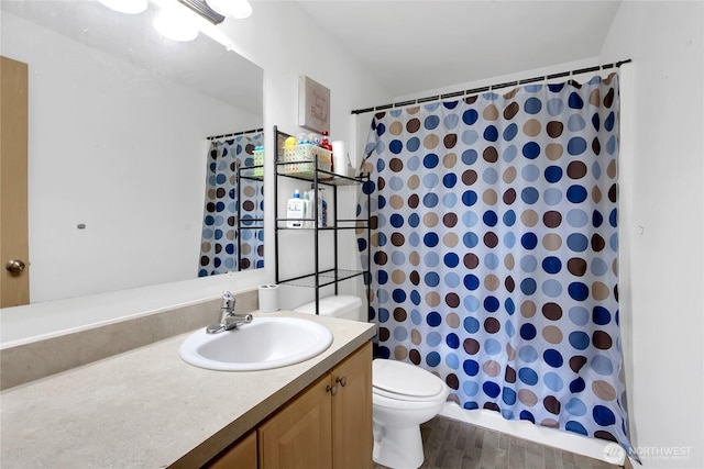 full bathroom with a shower with curtain, vanity, and toilet