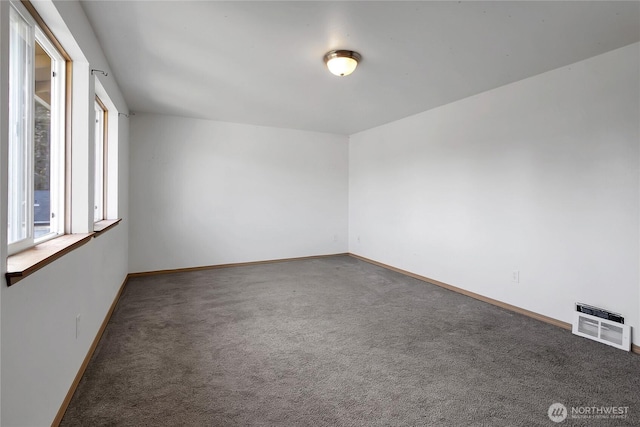 carpeted empty room with baseboards and visible vents