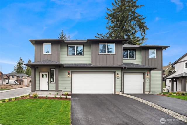 view of front facade with aphalt driveway, a garage, board and batten siding, and a front lawn